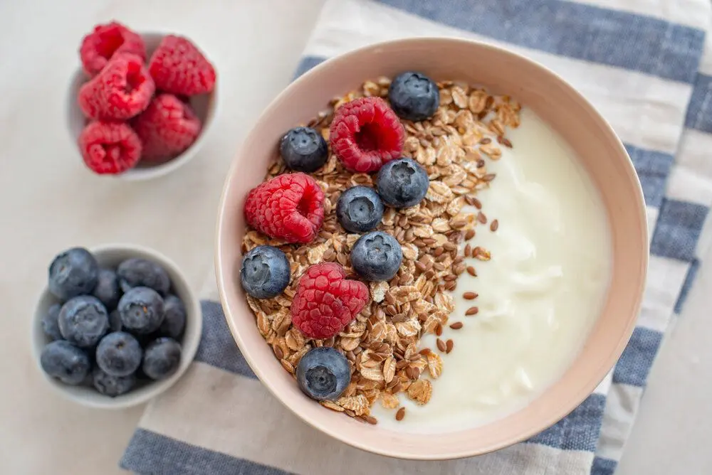 A bowl of granola with yoghurt and fruit