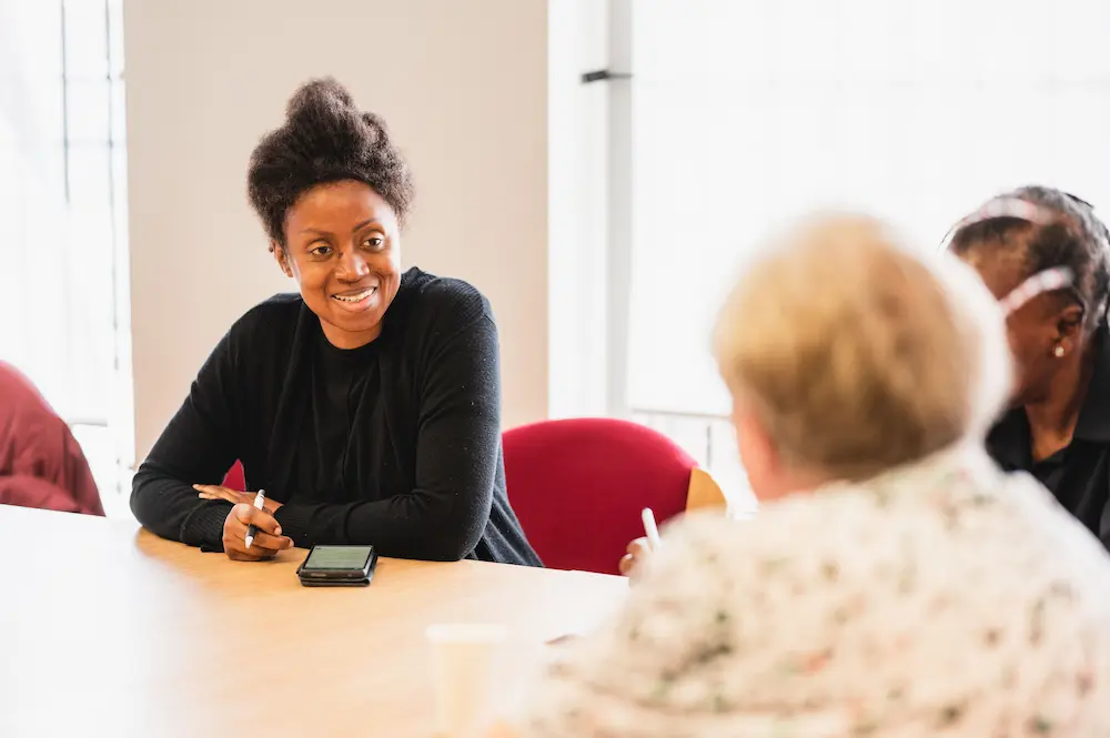 A female advocate speaking to a care seeker