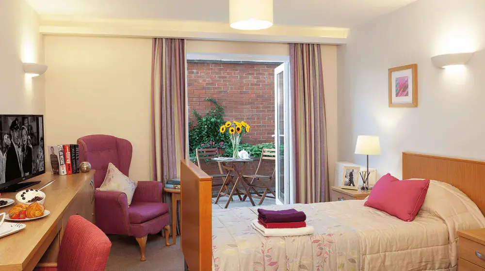 Aaron Court care home bedroom and patio
