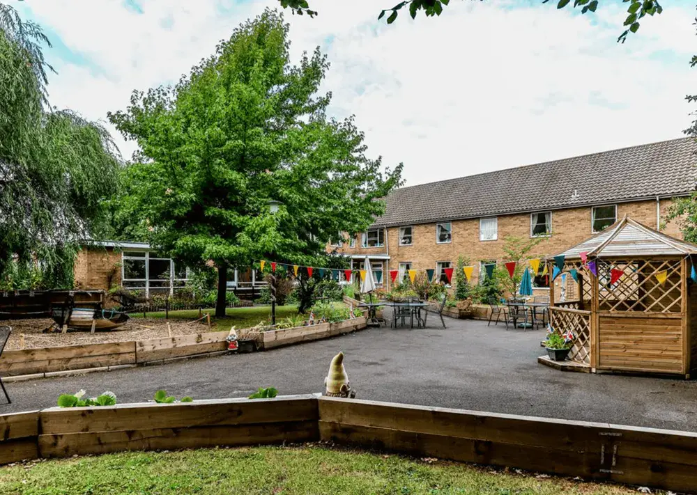 Brook House care home exterior and courtyard