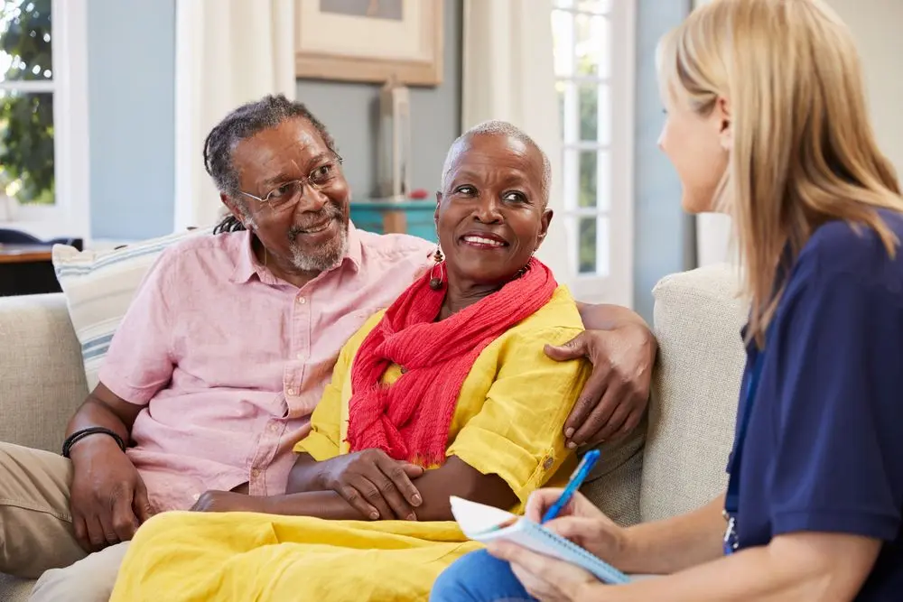 Female support worker providing home care