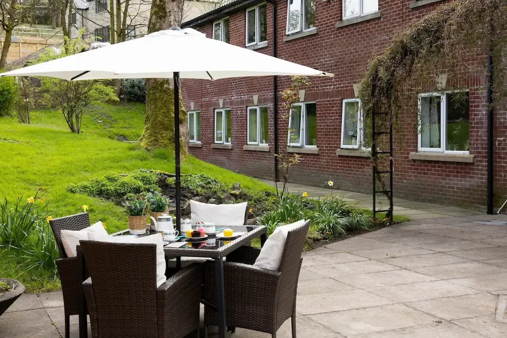 Highfield Hall Care Home garden, patio and exterior