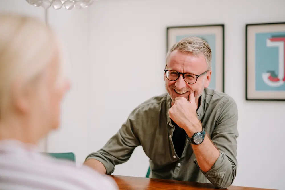 Man chatting with older woman