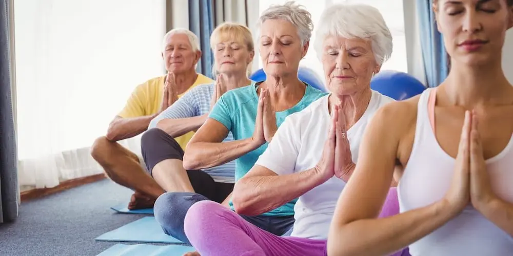 Older adults doing yoga