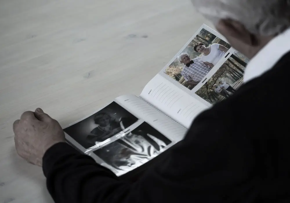 Older adults looking through a photo book