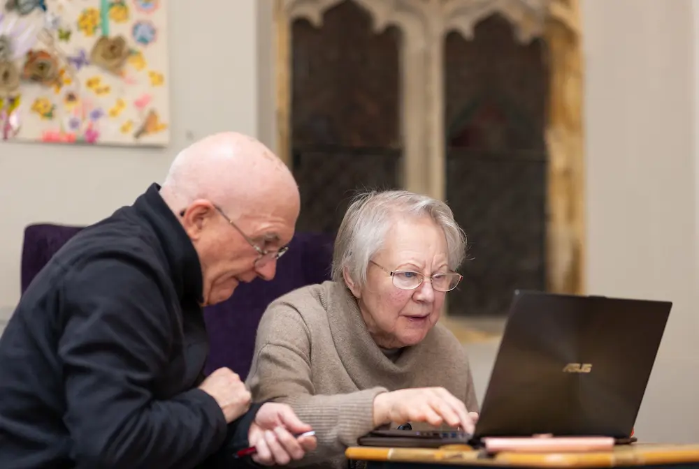 Older couple using a laptop together
