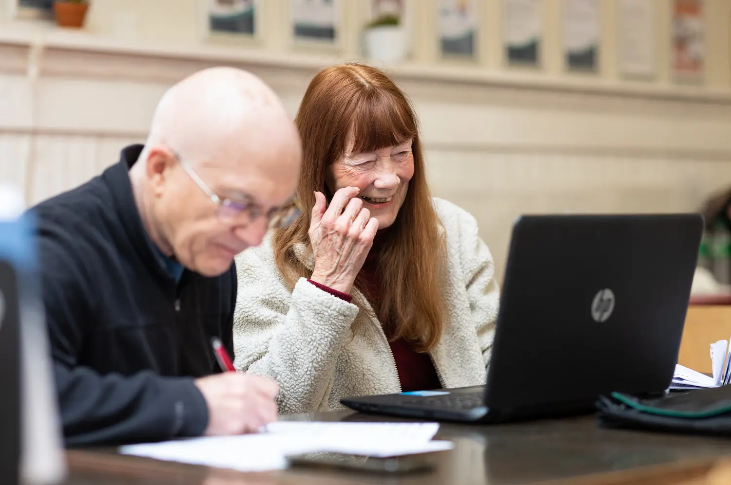 Older man and women using a laptop