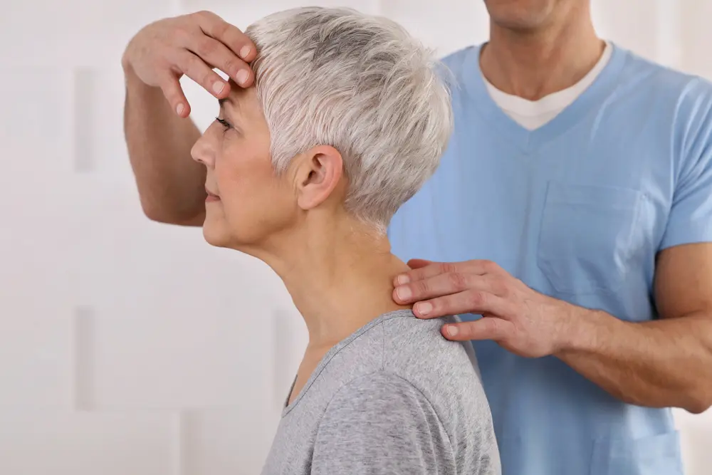 Older woman having chiropractic adjustment