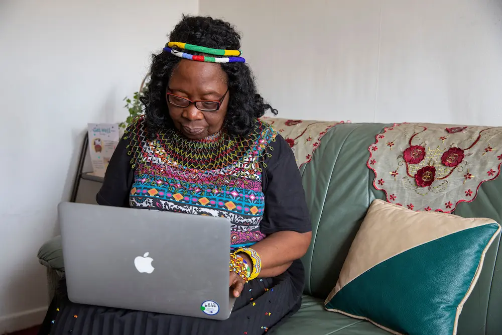 Older woman using a laptop at home