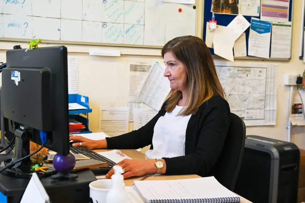 Woman typing on her computer